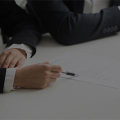 negotiations-about-contract-terms-concept-hand-pointing-document-closeup.jpg